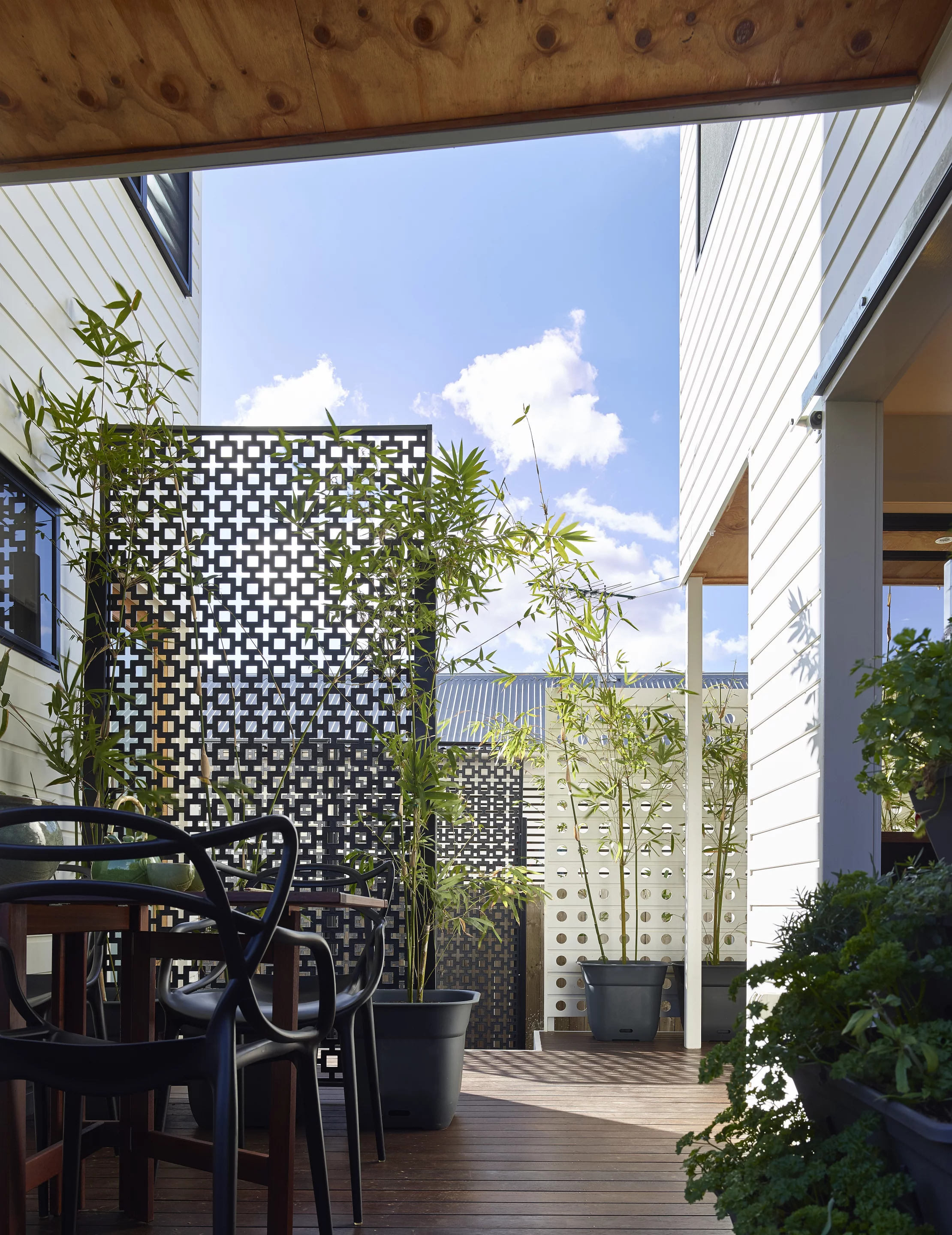 Outdoor seating at the Two Pavilion House, by Toussaint & Volz