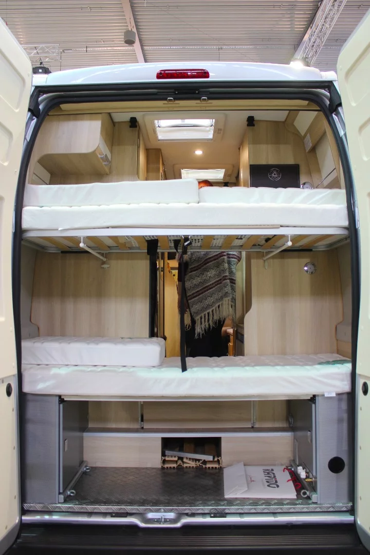 The Dreamer Family Van Select is loaded with beds: two rear single-sleeper bunk beds, a convertible dinette bed and a drop-down double bed over the dinette