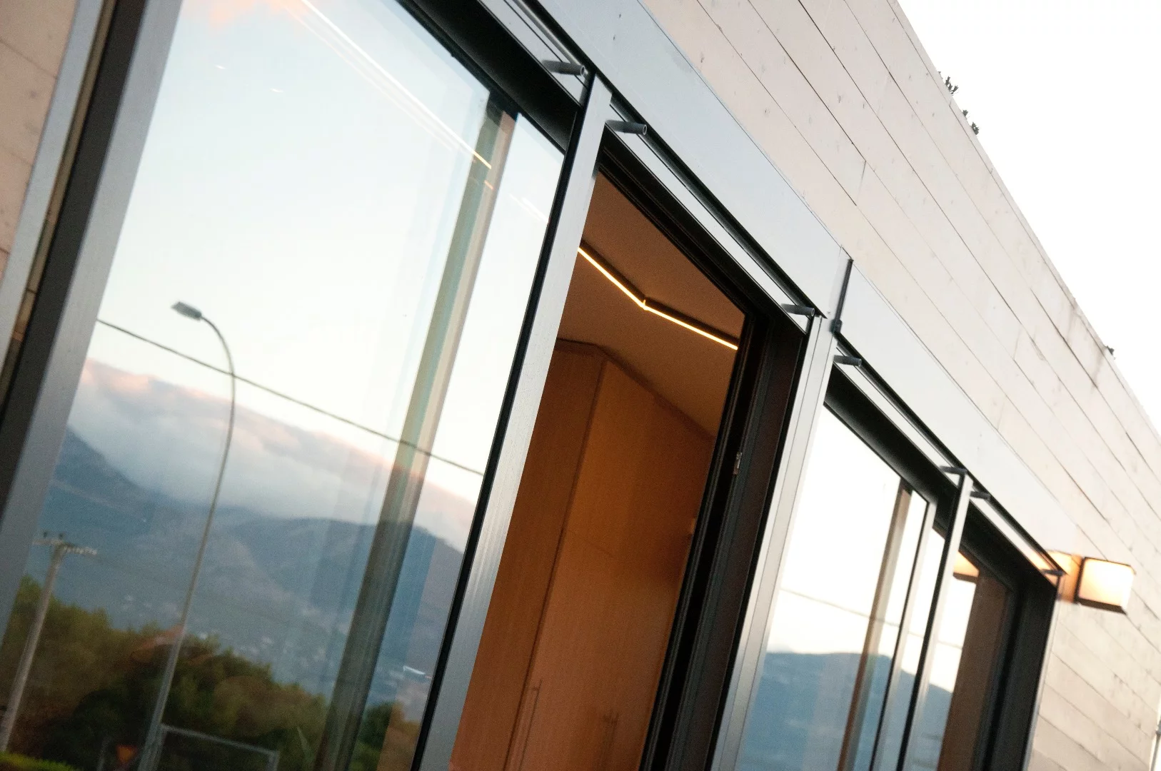 Cocoon Modules' shipping container house is fronted by operable glazing