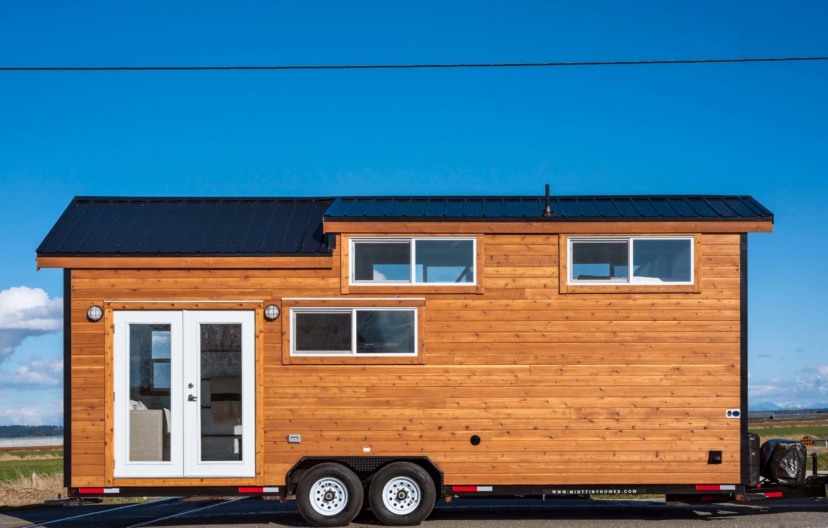 The Napa tiny house RVs are built with cedar exterior cladding and lightweight metal roofing