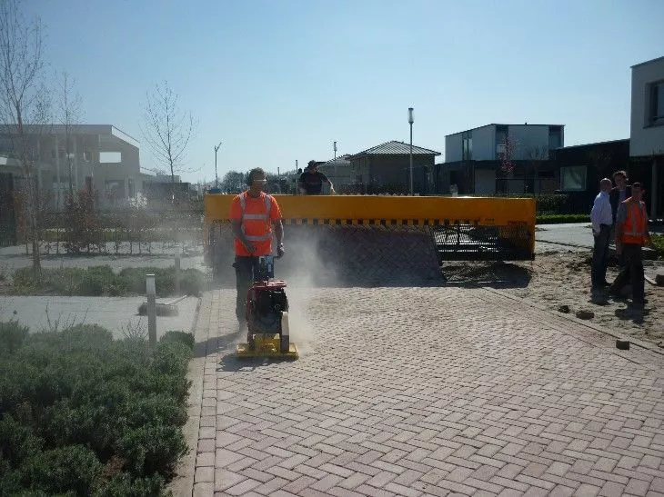 The Tiger Stone laying a brick road