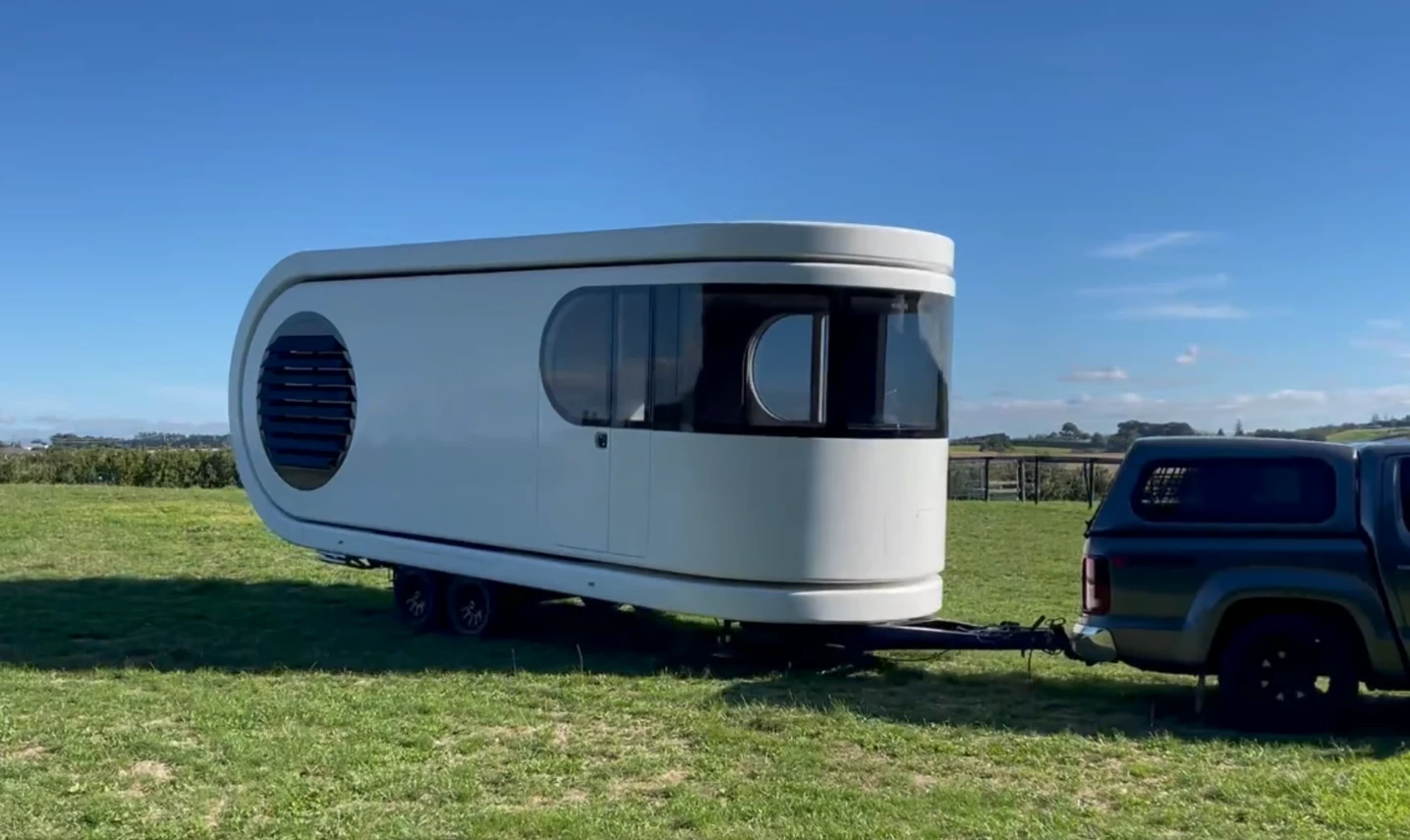 The new Romotow T8 will look largely the same as the T8+ pictured while towing, just without the extra height and length of the open deck seen sandwiching the main body