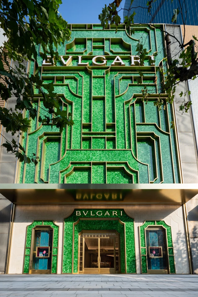 Bulgari Shanghai's facade is made up of recycled glass bottles, which have been melted down and pressed into panels