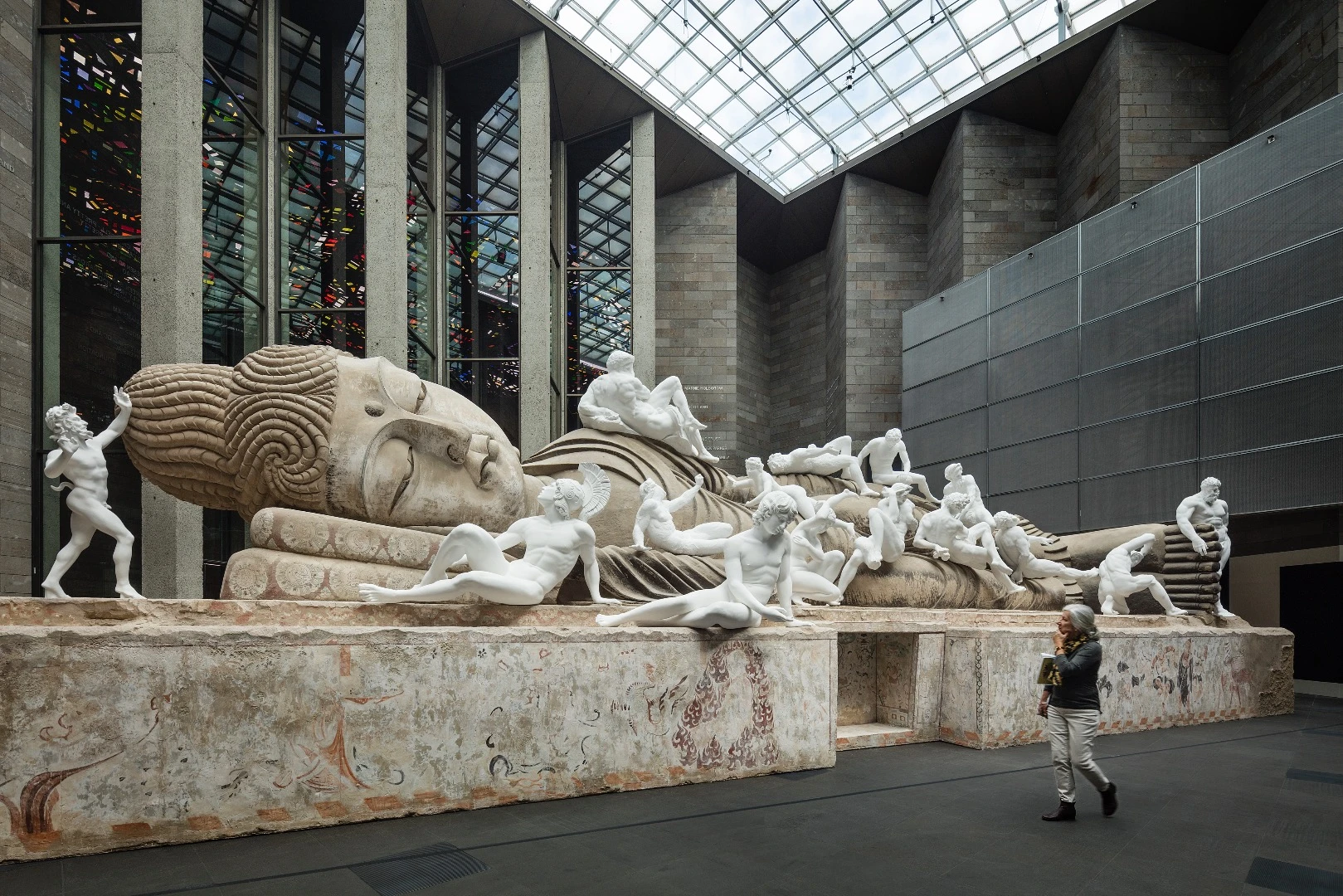 Installation view of Xu Zhen Eternity - Buddha in Nirvana, the Dying Gaul, Farnese Hercules, Night, Day, Sartyr and Bacchante, Funerary Genius, Achilles, Persian Soldier Fighting, Dancing Faun, Crouching Aphrodite, Narcissus Lying, Othryades the Spartan Dying, the Fall of Icarus, A River, Milo of Croton 2016 – 17 on display at NGV Triennial at NGV International, 2017