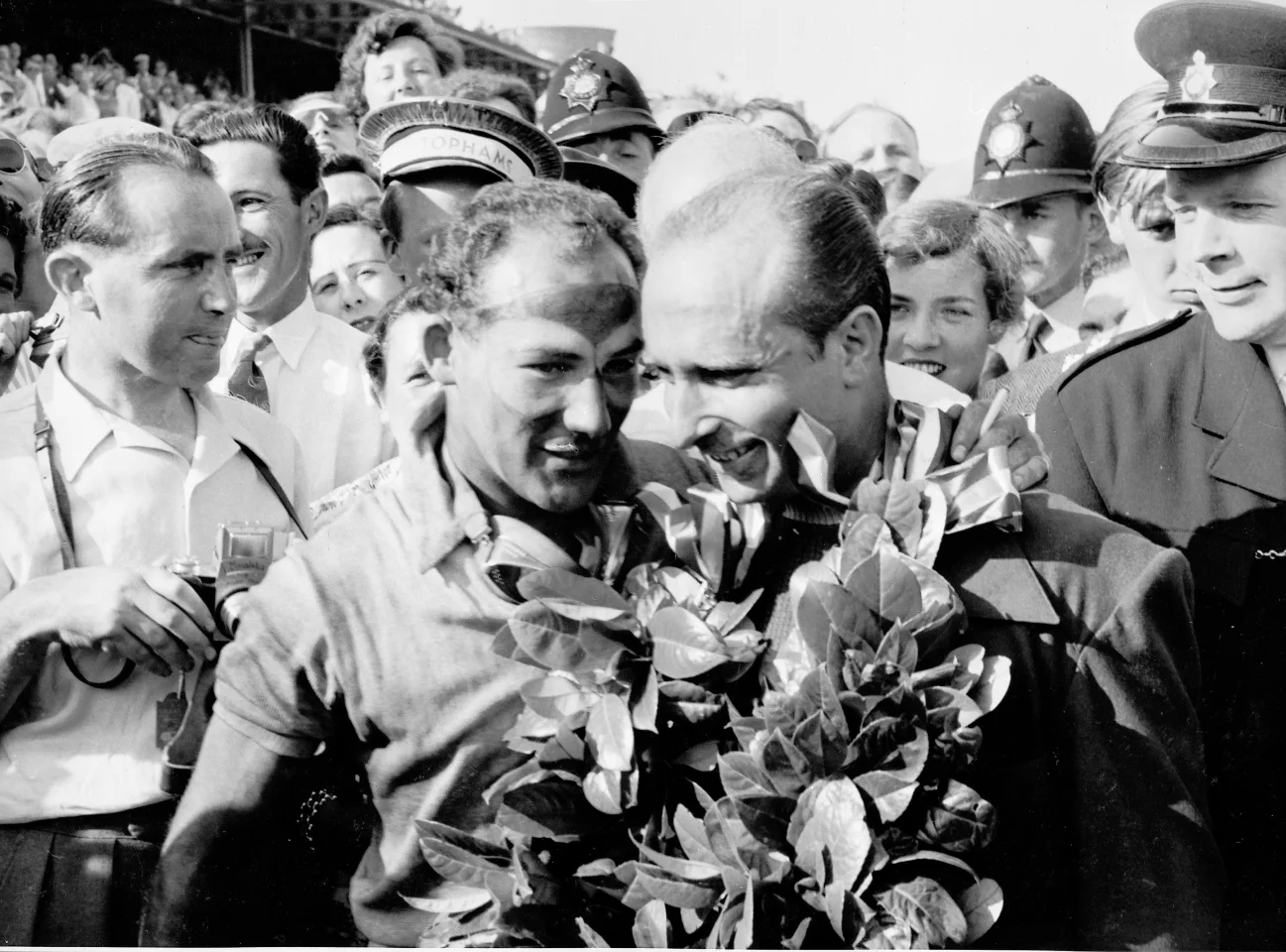 One of the most talented driver pairings in Grand Prix history - Sterling Moss (centre left) and Juan Manual Fangio (centre right)