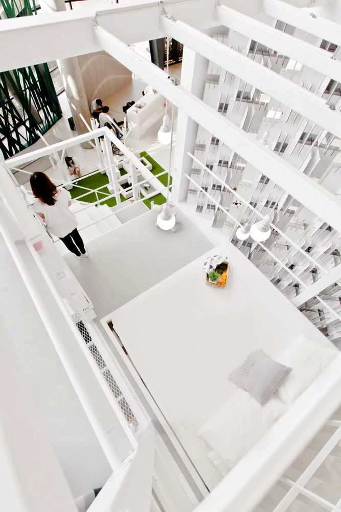 The living space contains two main floors, two mezzanines, and a vertical garden