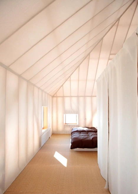 The Japanese larch frame is exposed through the translucent material