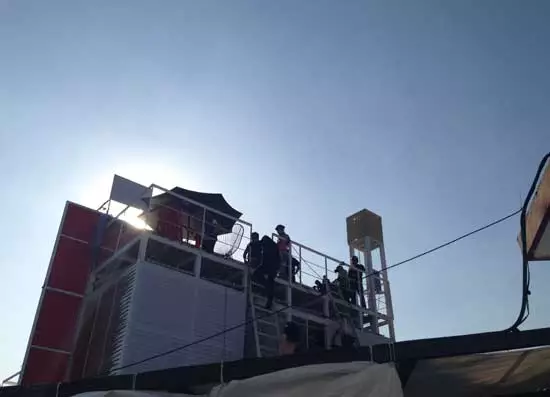 The roof has a wooden terrace that's separate from the main building, which both shadows the house from excess heat and gives residents an outdoor area for relaxing