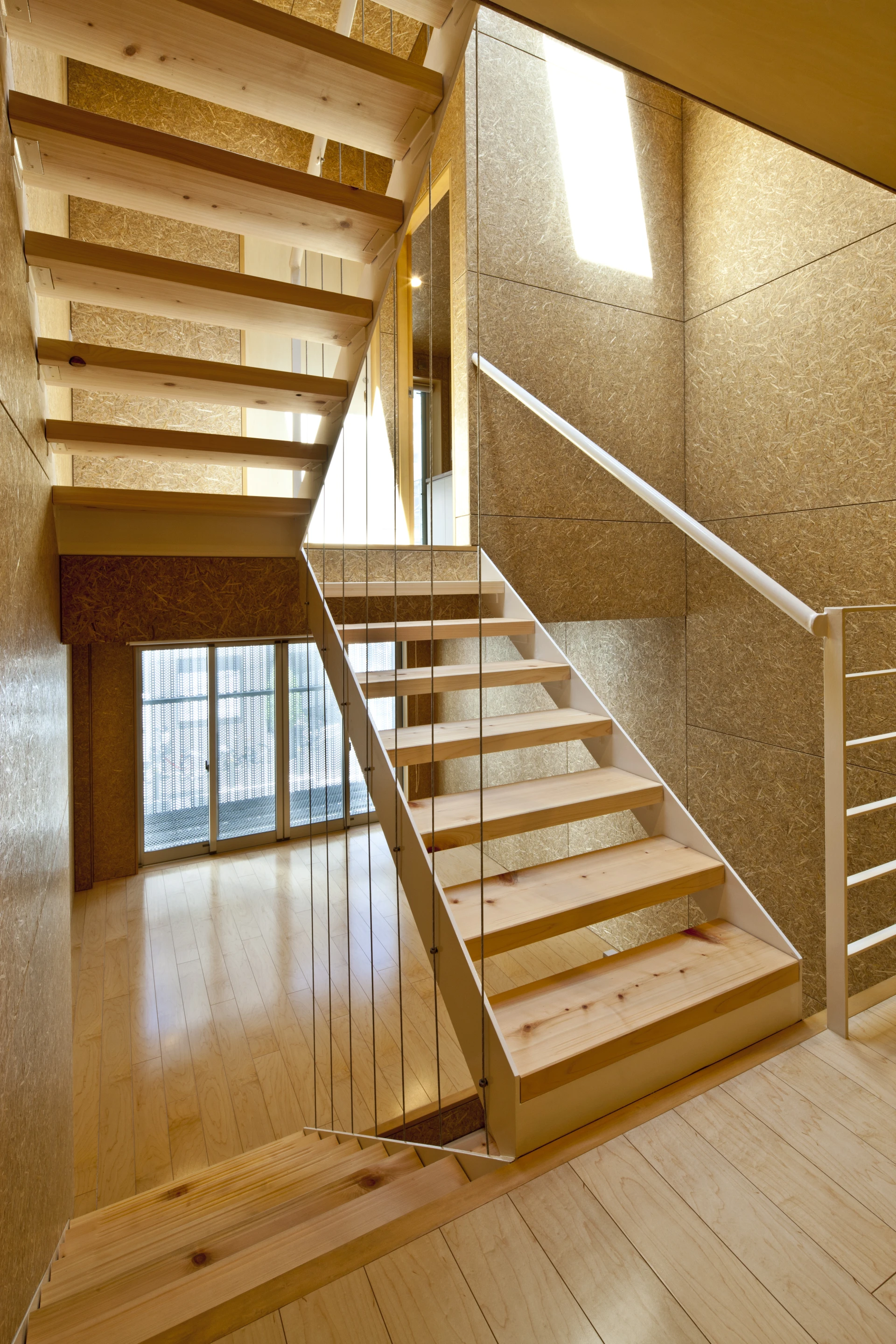 A wooden stairway runs up the center of the house (Photo: Stirling Elmendorf)