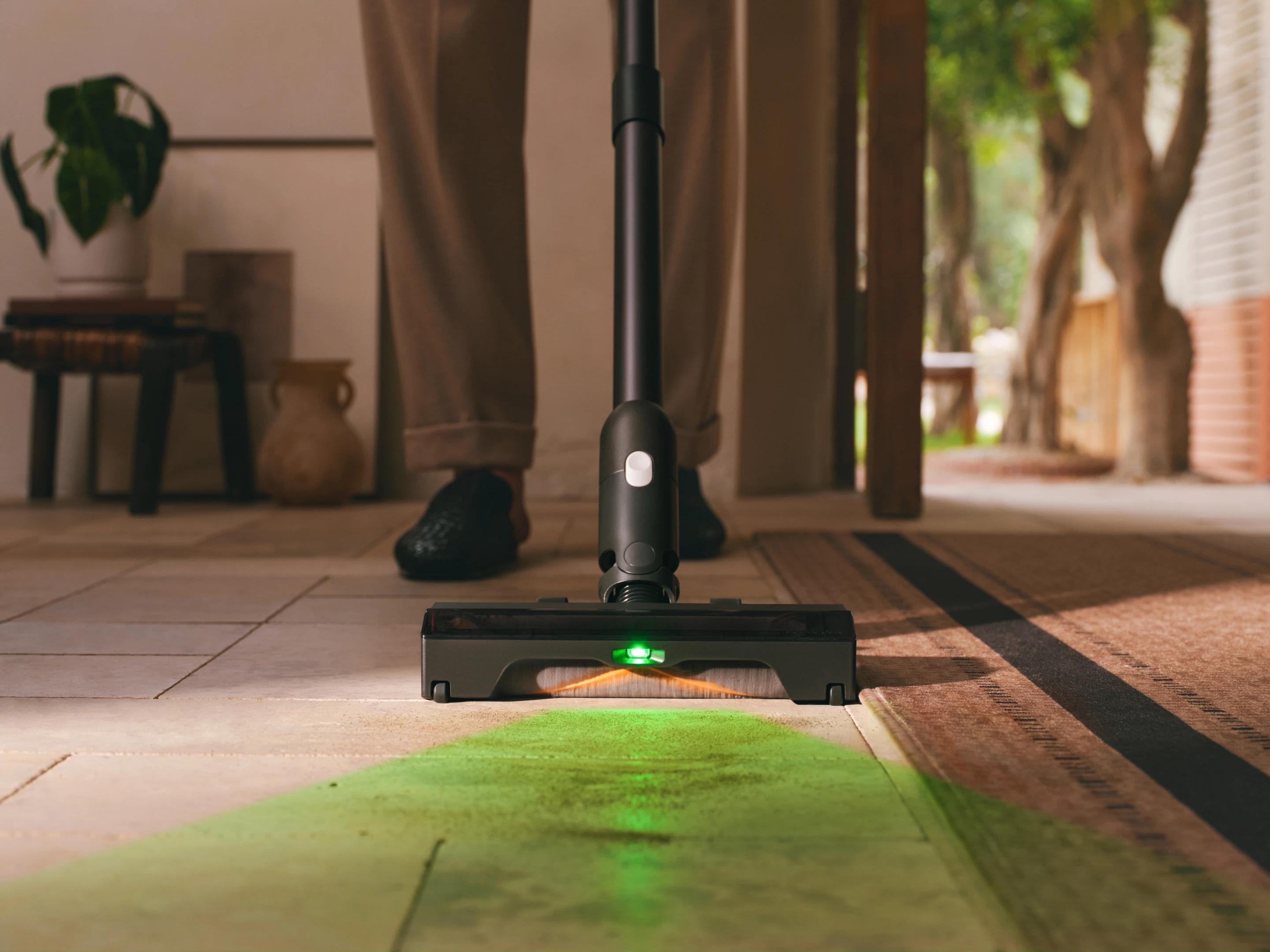 A light so low and so green makes grot on the floor cast a long shadow