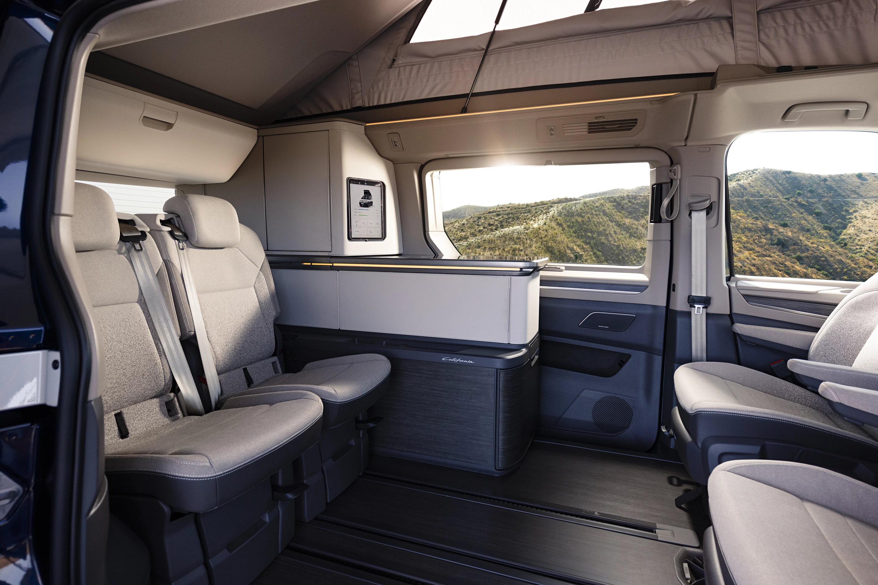 The 2023 Volkswagen Multivan California Concept's floor rail-mounted individual rear seats can slide forward and back or remove completely for full versatility