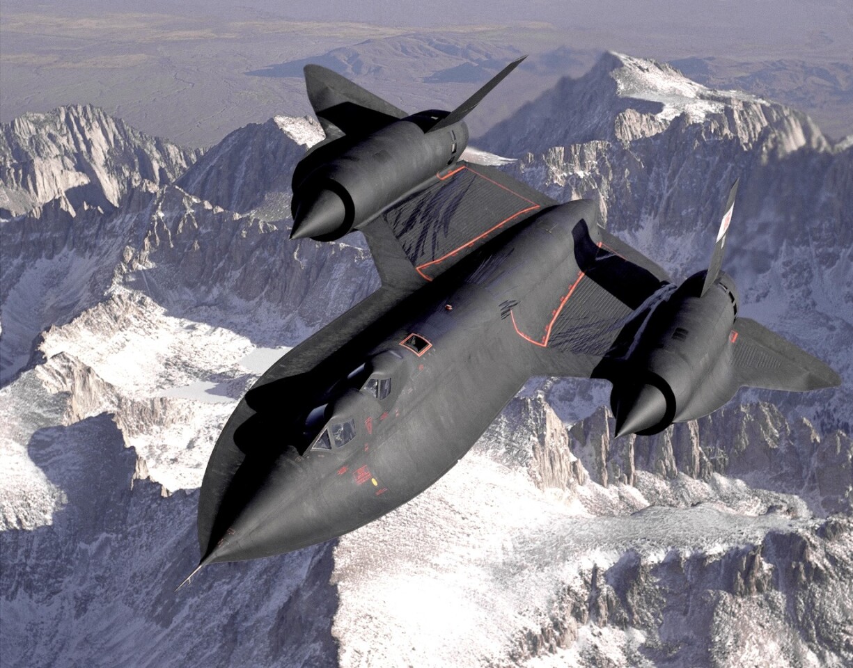 SR-71B Blackbird, NASA 831, slices across the snow-covered southern Sierra Nevada Mountains of California after being refueled by an Air Force tanker during a 1994 flight. SR-71B was the trainer version of the SR-71. The dual cockpit to allow the instructor to fly. Note the streaks of fuel from refueling spillage