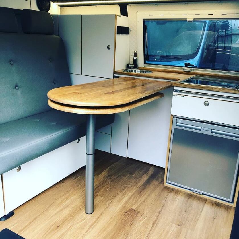 The removable dining table secures to the kitchen w