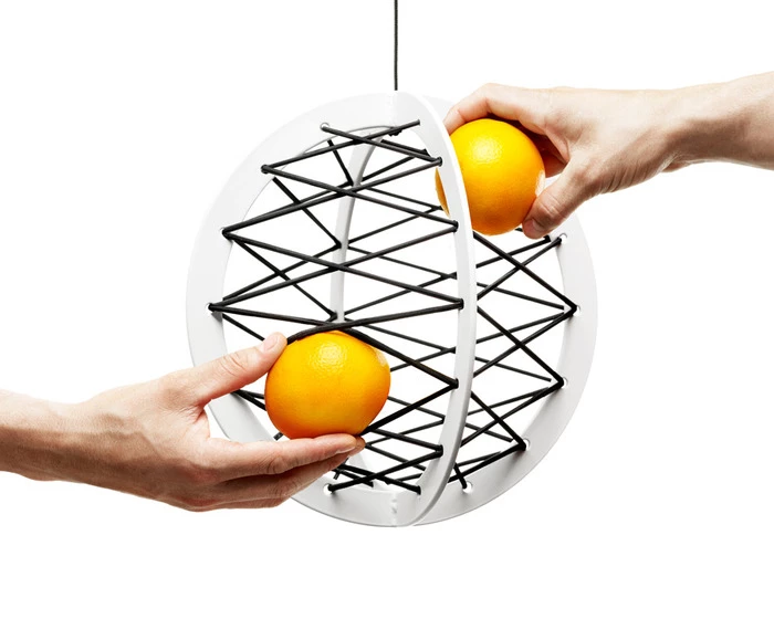 Pluk is suspended from your ceiling to store apples, oranges or anything you can fit inside its frame