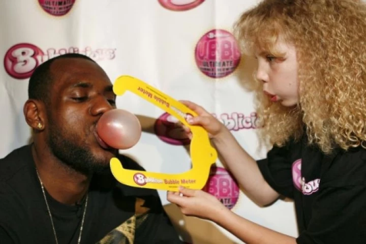 Basketball star LeBron James has been appointed official U.B.B.L. commissioner. That's Lebron showing his prowess and a fan measuring the size of his bubble with a bubble meter.