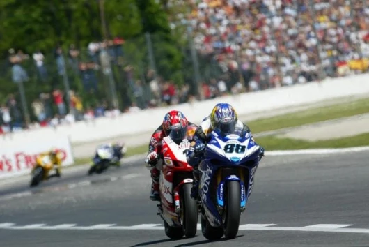 Andrew Pitt 's Yamaha R1 holds out Regis Laconi early in the first race. Laconi got fourth, Pitt got fifth.