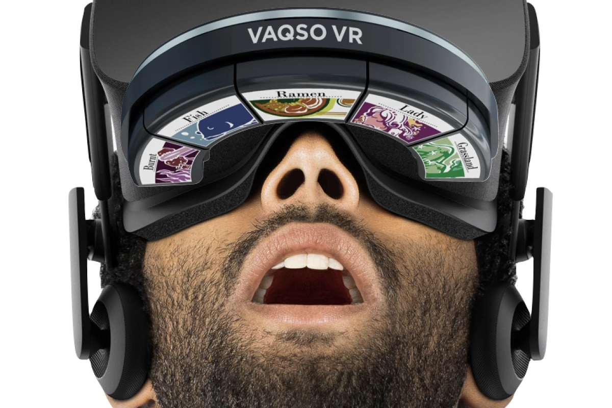 The main Vaqso device is attached to the user's head via an adjustable velcro strap, and it communicates with their VR headset