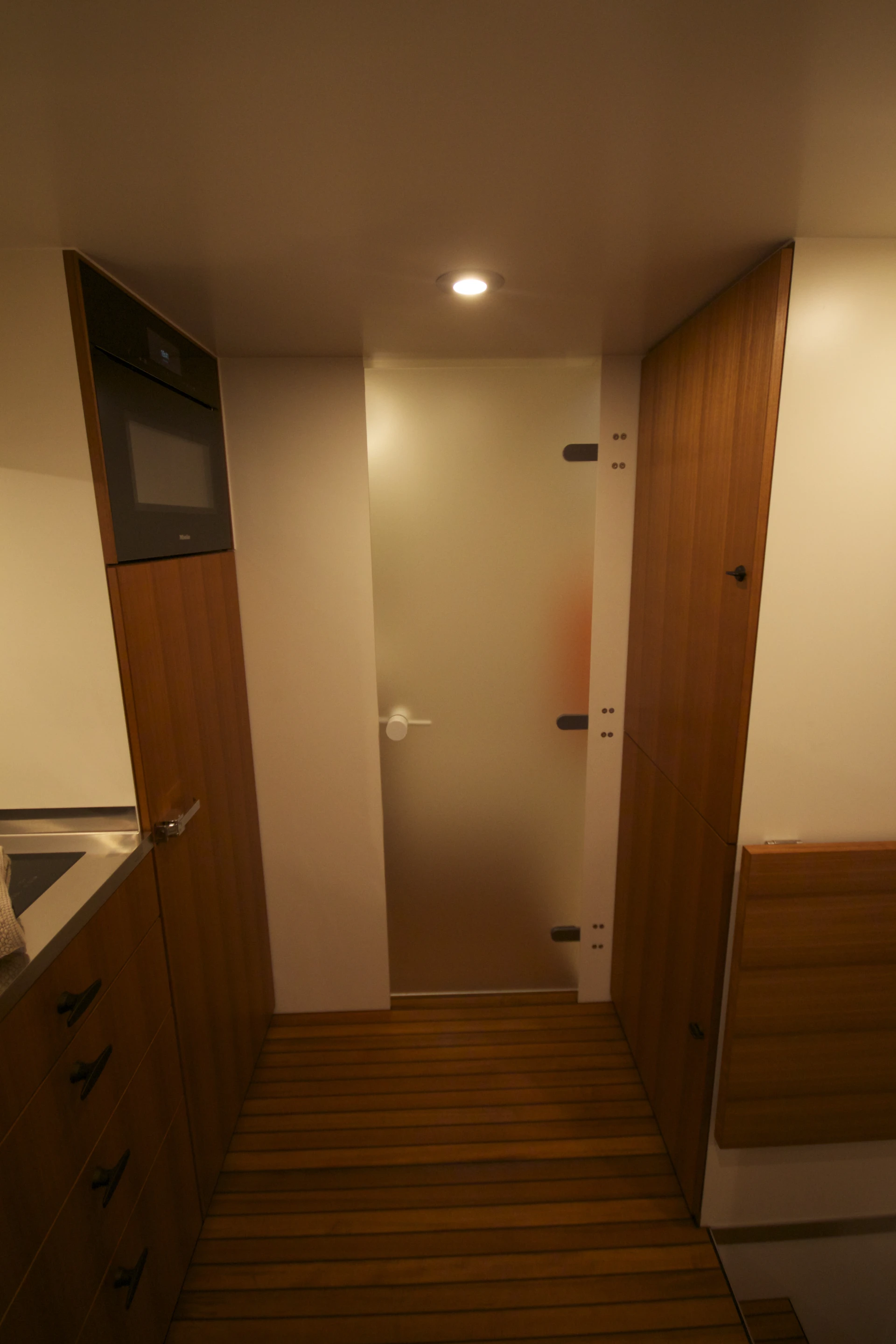 A door cuts off the living area from the bathroom and driver pass-through