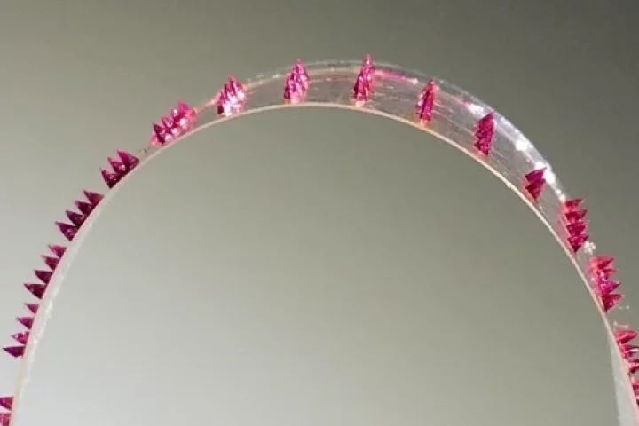 A strip of tape, with dissolvable microneedles stuck to it