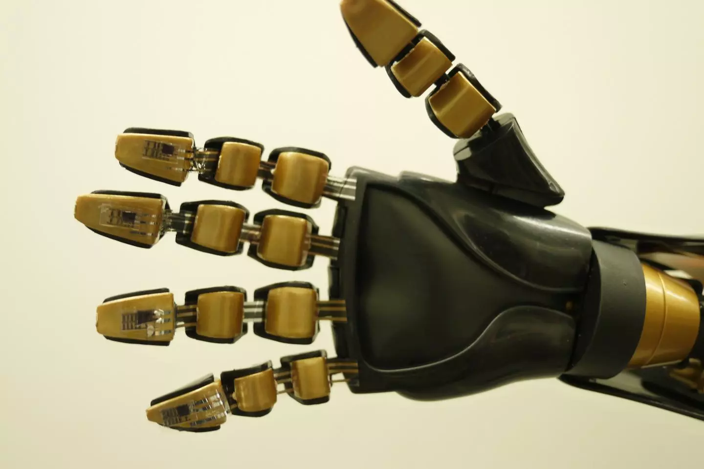 A robotic hand, with the touch-sensitive skin applied to its fingertips