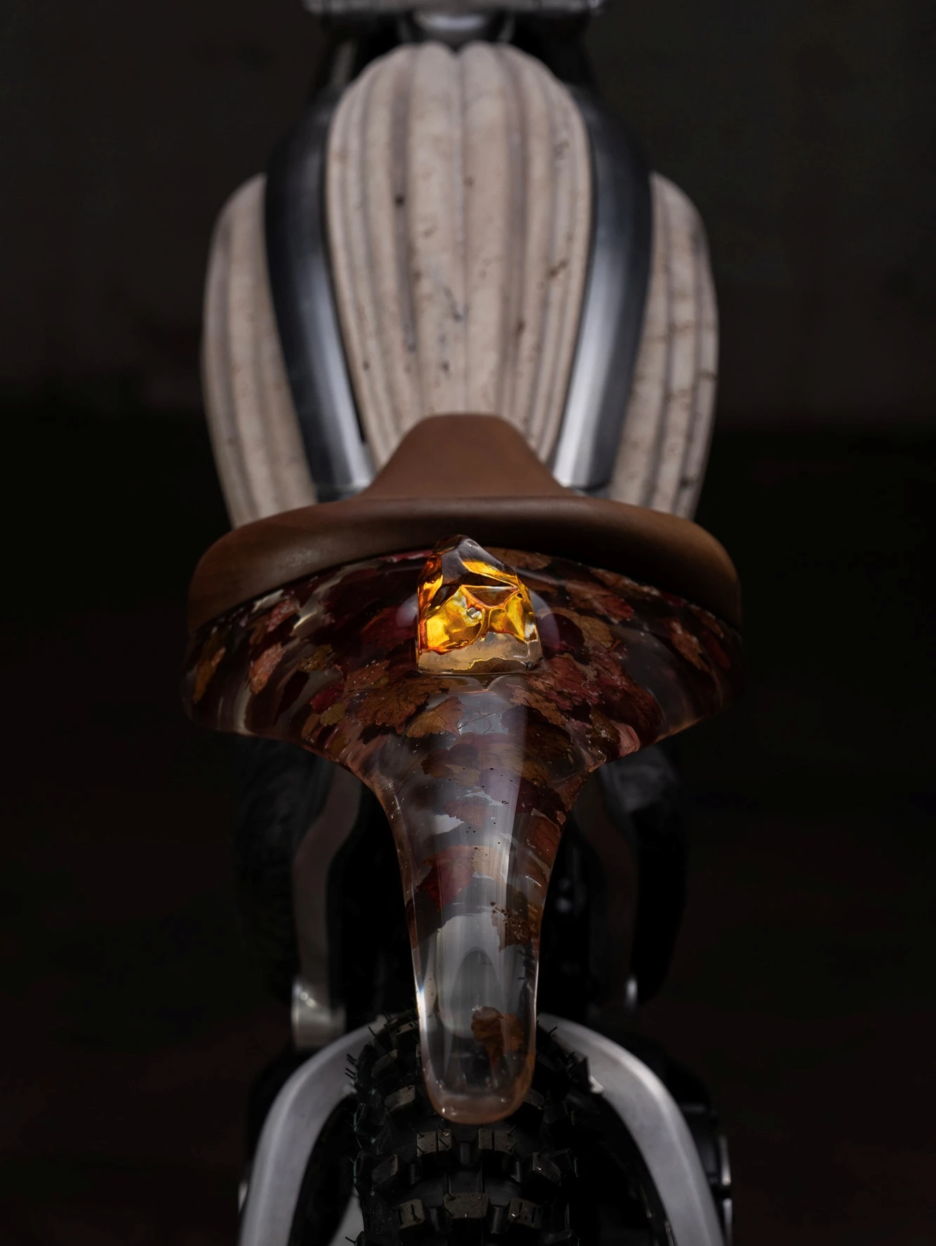 The traditional LED headlight and taillight have been switched out for hand-blown glass sculptures