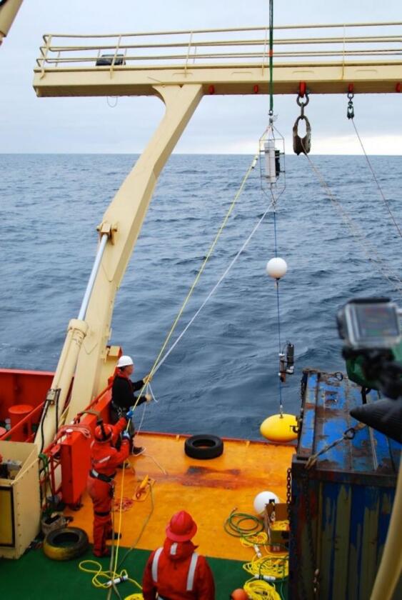 VIMS Assistant Professor Elizabeth Shadwick (holding yellow rope) helps deploy her mooring, containing CO2, temperature, salinity and pH sensors