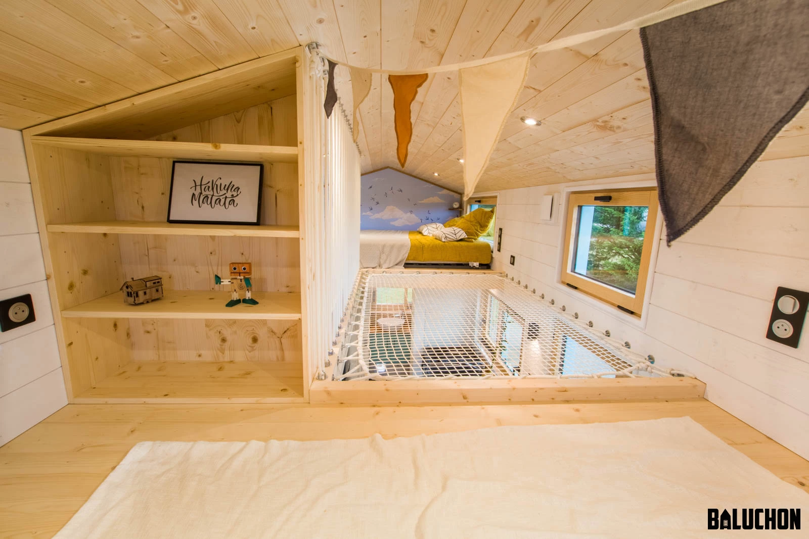The Tiny house Kalzennig's secondary bedroom features a little storage space, in addition to the bed