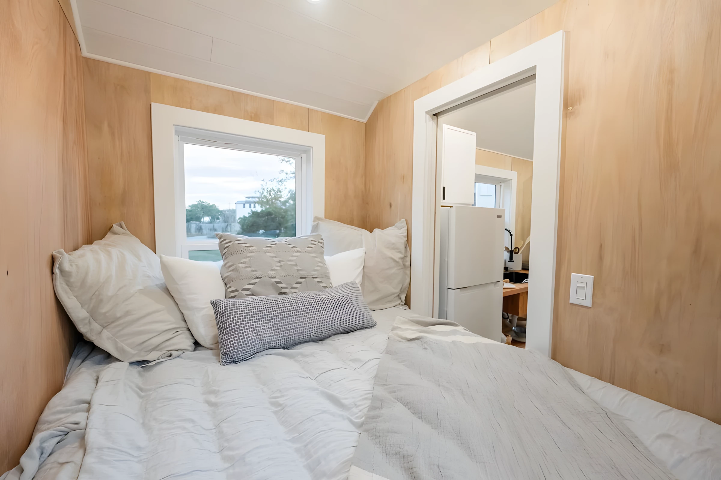 The Lad's bedroom features a double bed with integrated storage space