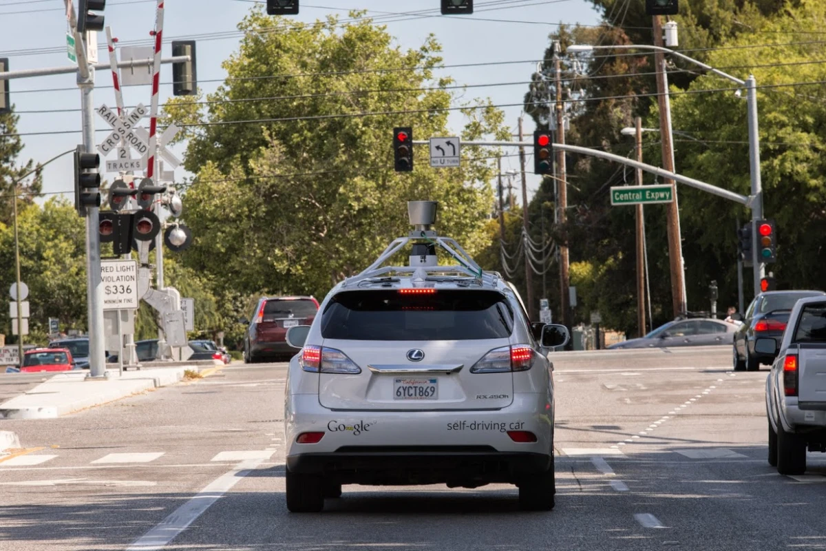 The Google Self-Driving Car prototype, based on a Lexis SUV, waits patiently at a traffic light