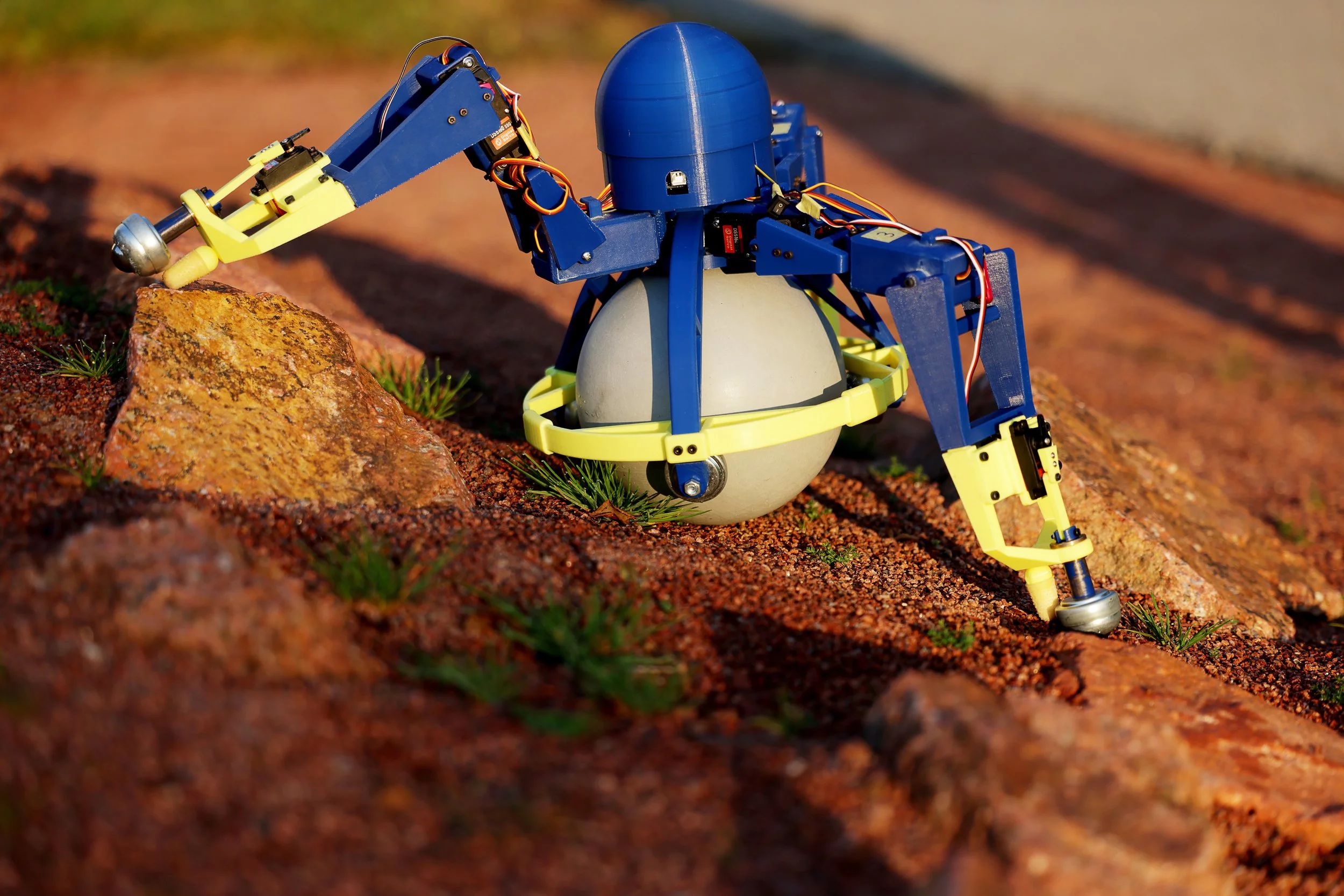 The SKOOTR bot gets around on three motorized legs, with a large freely rotating sphere providing additional stability