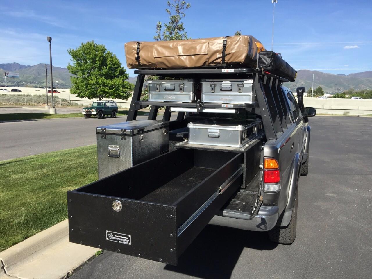 The bed-mounted drawer and fridge slide