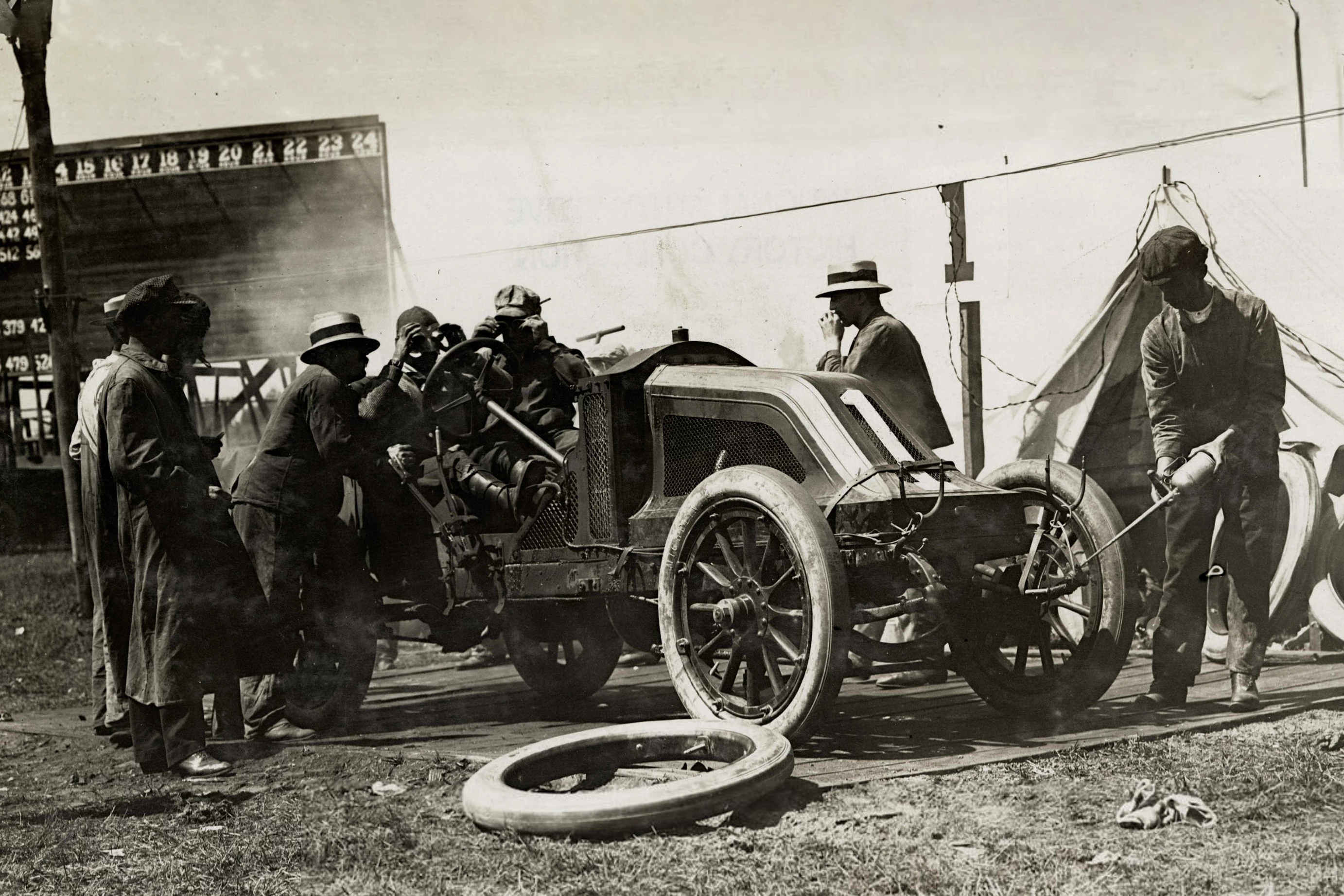 The 1907 Renault Type AI 35/45HP Vanderbilt Racer immediately began winning races when it arrived in the United States. Here Renault driver Louis Raffolovitch can be seen during a pit stop during the 24 hour race at Morris Park Raceway, New York, September 1907. The detachable rim for the right front wheel can be clearly seen. The innovation saved valuable time in changing tires during races.
