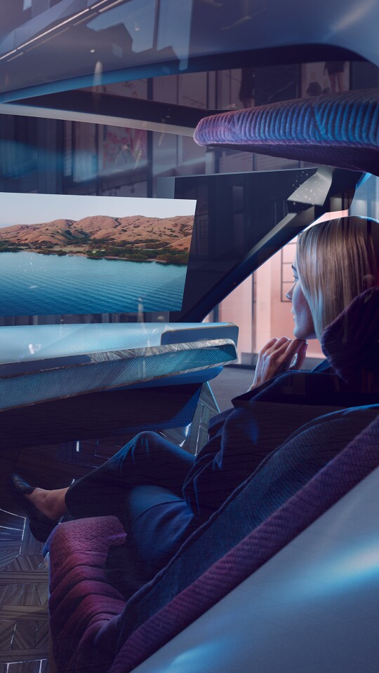The large head-up display on the Interaction Ease's windshield has three modes: Explore mode delivers augmented reality information about the surroundings; Entertain mode offers digital entertainment; and Ease mode darkens the cabin for relaxation