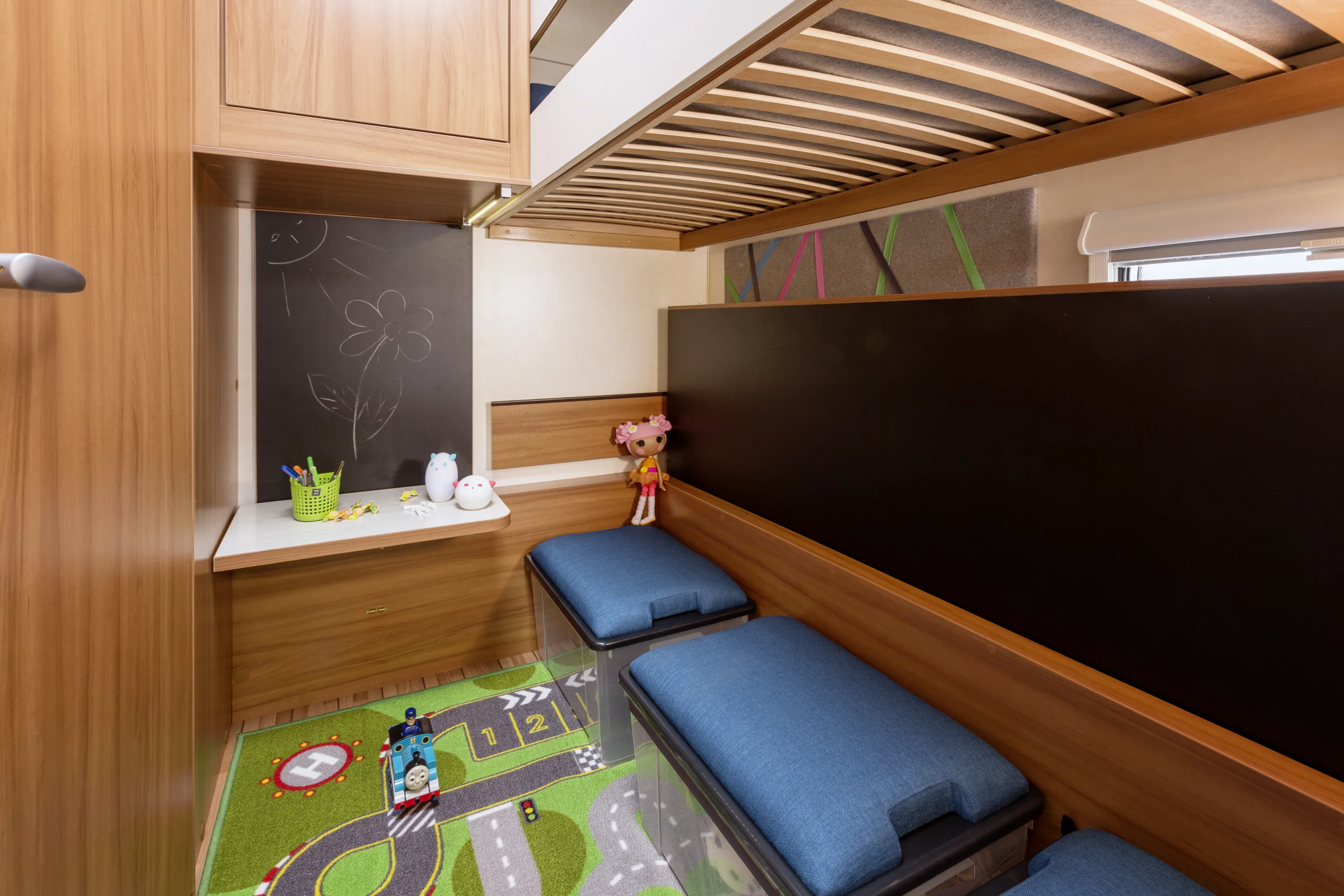 The CaraKids CaraOne caravan includes a kids' bunk bedroom that converts into a more spacious play area