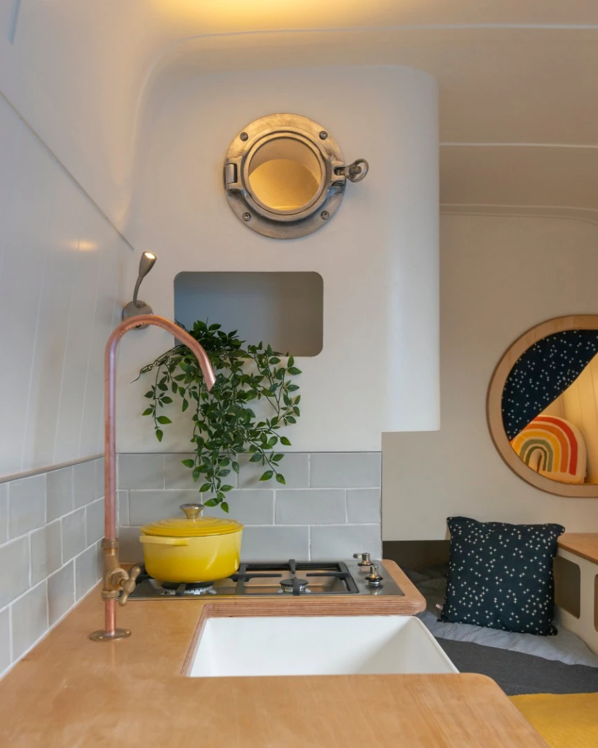 Kitchen with LPG double stove top, custom made light weight basin and 50 liter fridge