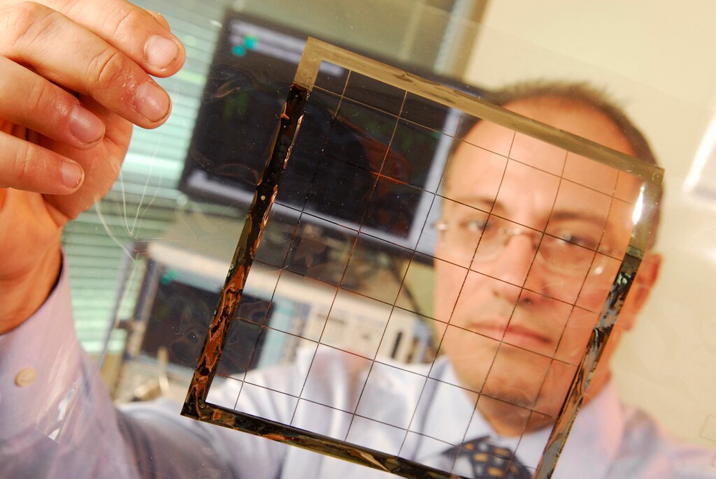 Manos Tentzeris displays an inkjet-printed rectifying antenna used to convert microwave energy to DC power (Image: Gary Meek)