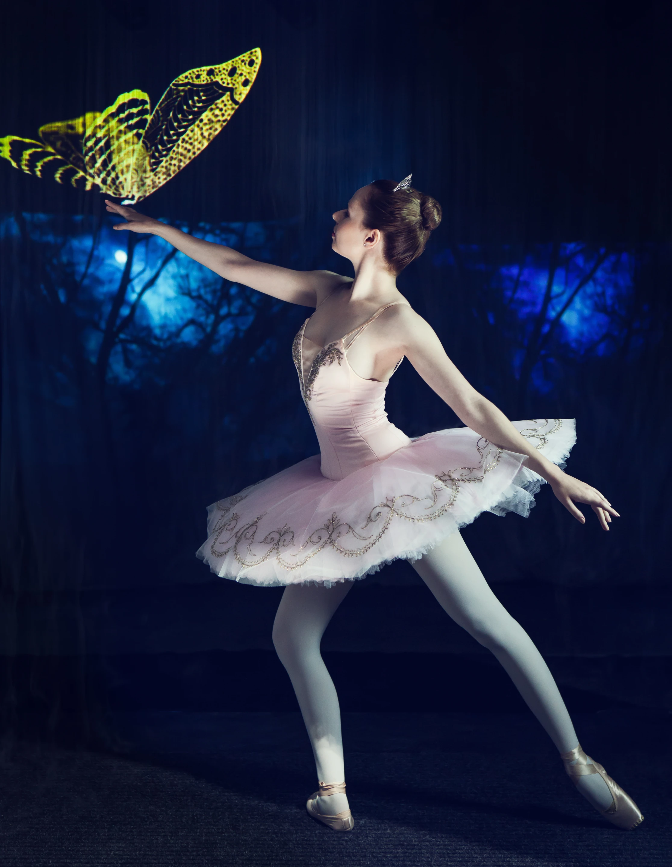 A young woman manipulating the mist and dancing within the display