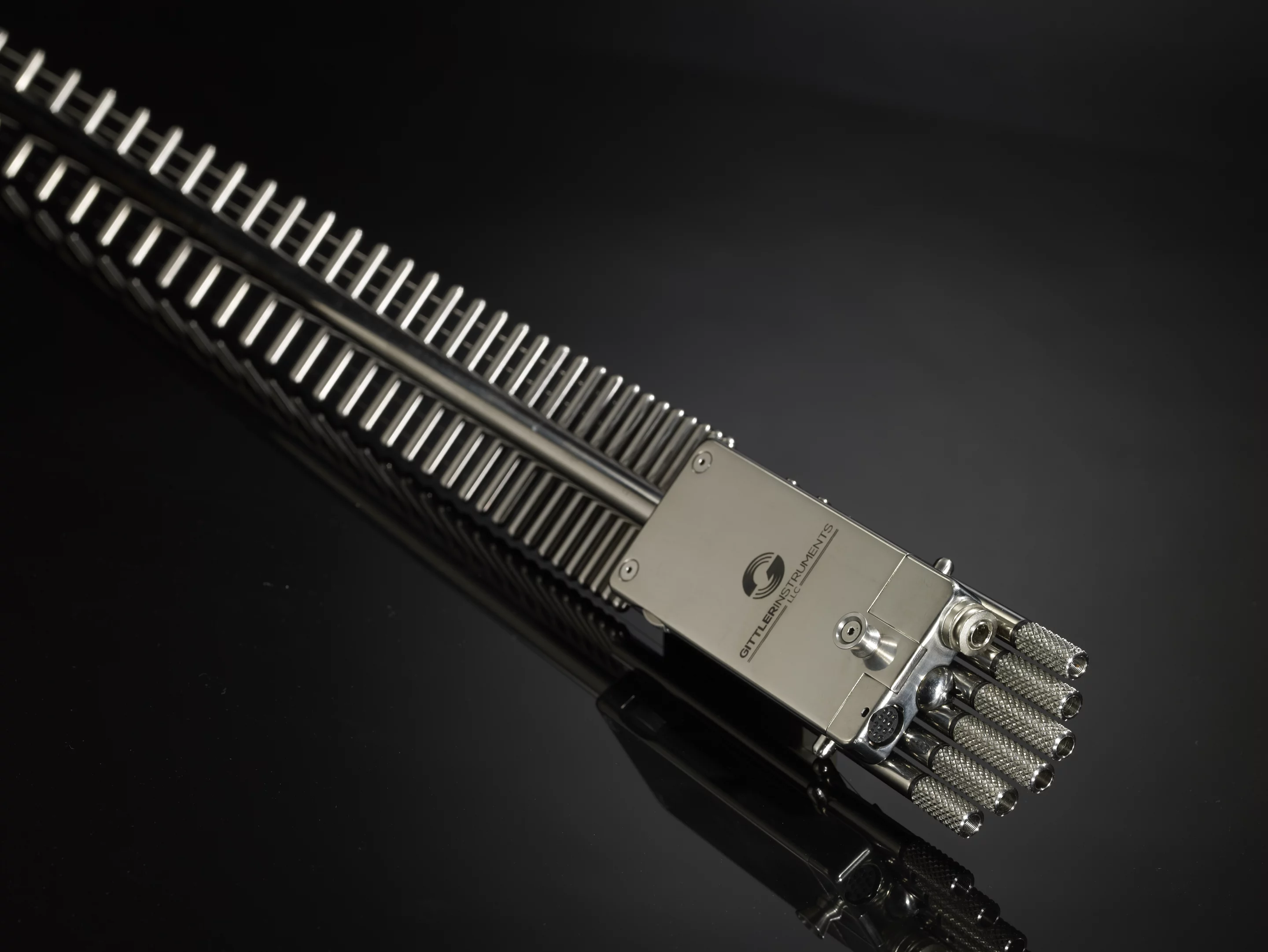 The Gittler Guitar has custom-designed pickups, Teflon-coated, rear-mounted tuners, and an adjustable bridge