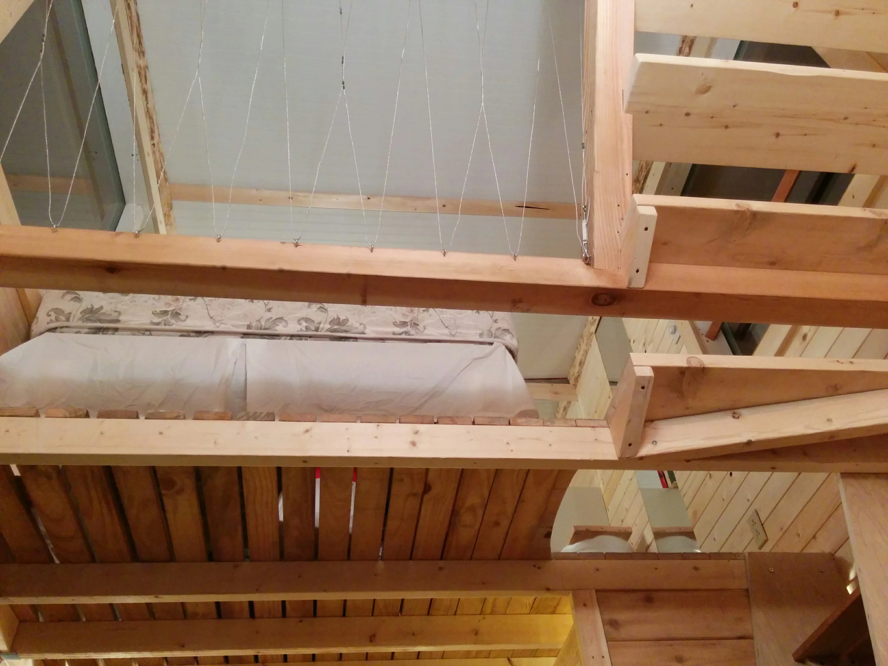 Steps with integrated storage lead from the living area to a loft space with a double bed for guests (Photo: Geoff de Ruiter)