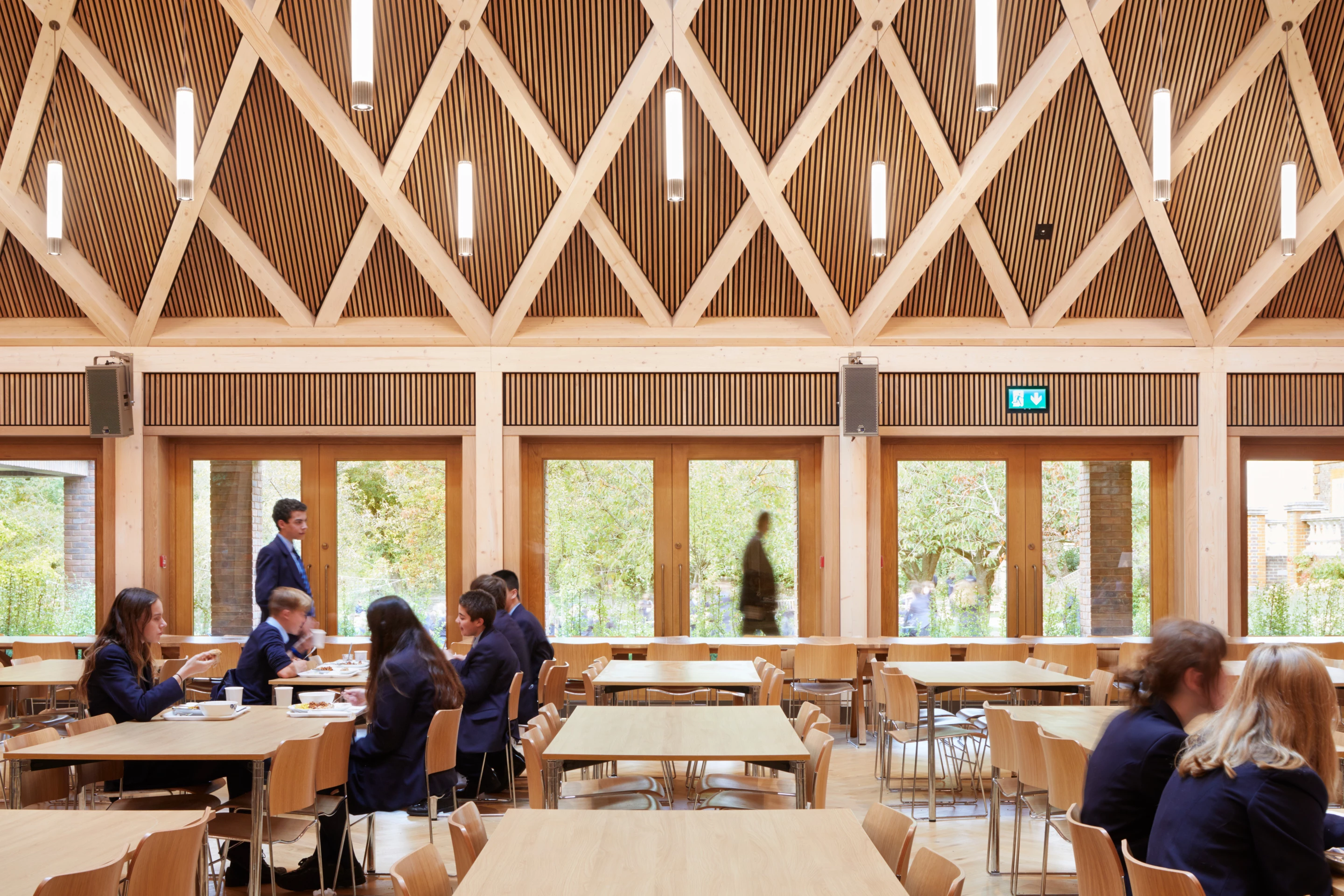 Ibstock Place School Refectory was designed by Maccreanor Lavington and is located in London. It consists of a criss-cross glulam structure and timber ceiling designed to impress visitors