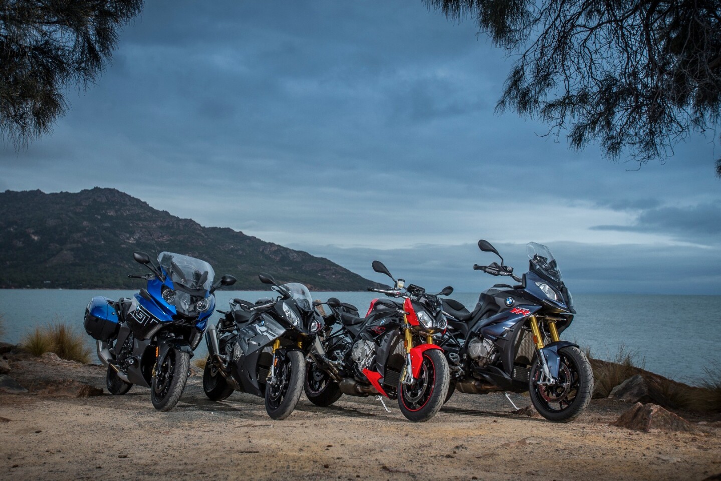 BMW's K1600GT, S1000RR, S1000R and S1000XR on the beach in Tasmania