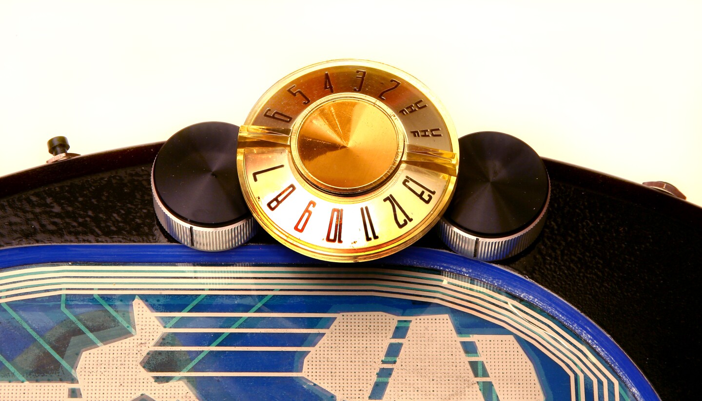 The large golden wheel was once used on an old television and now controls oscillation