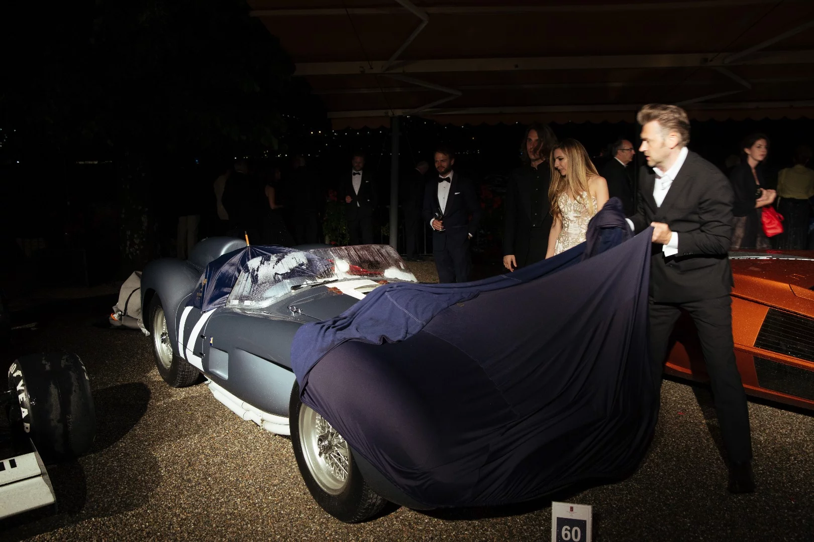 Andreas Mohringer's 1958 Ferrari 335 Sport Spider got caught in the rain without a cover during the black tie awards dinner.