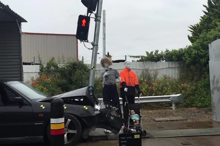 Testing shows how one of the prototype poles absorbs impact energy by tilting to one side when hit by a car, instead of snapping off and possibly hitting bystanders