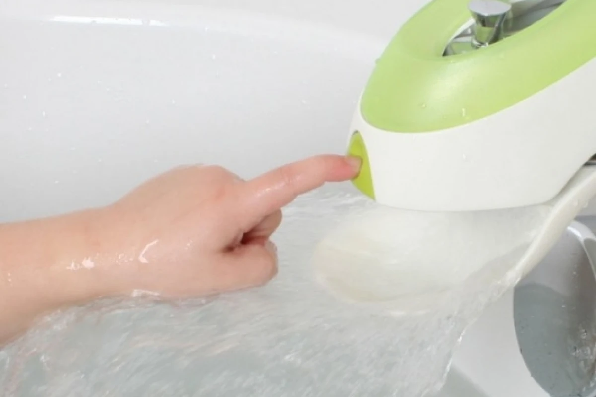 Boon's Flo multi-functional faucet cover