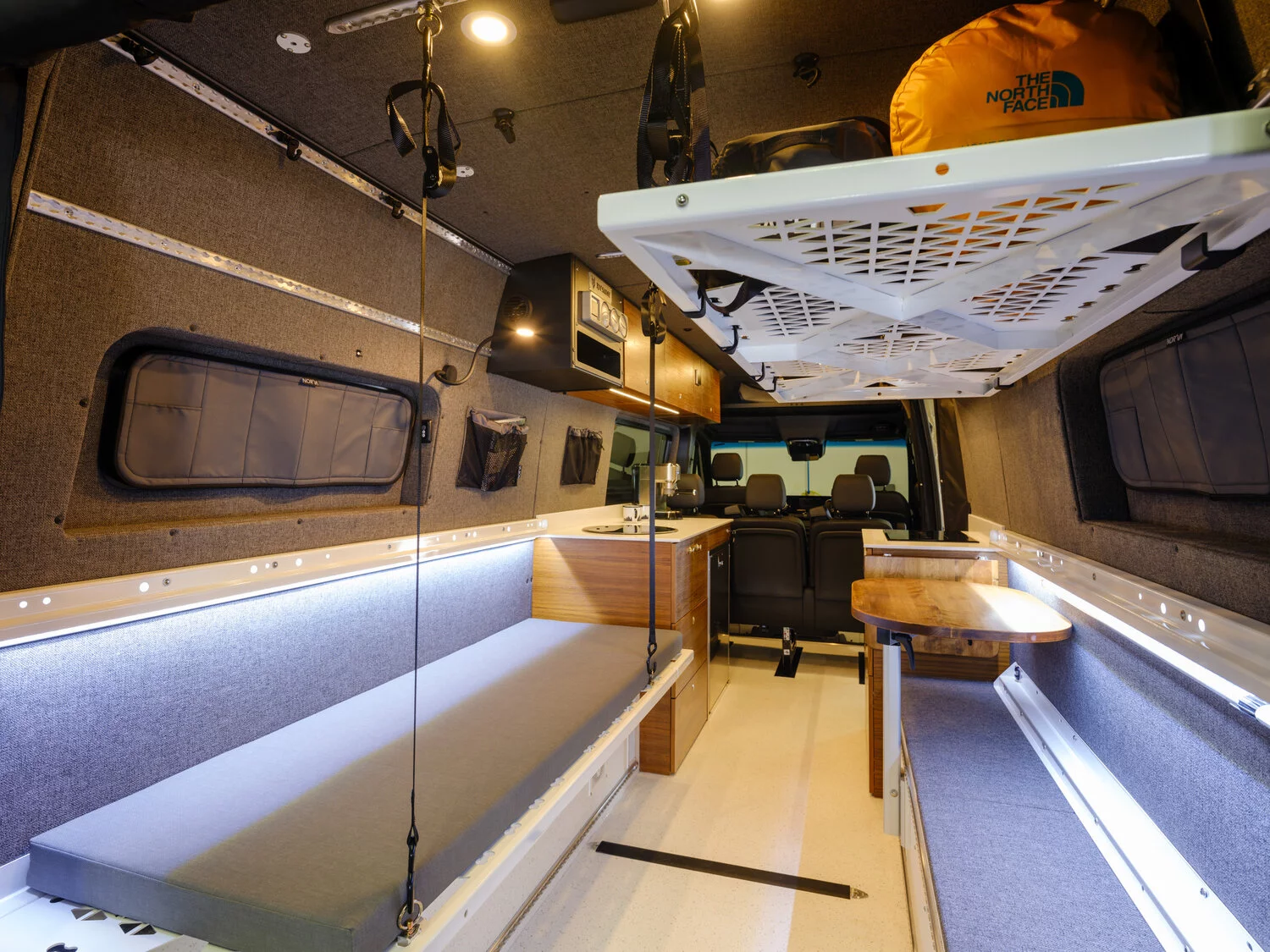 The left bed panel is set up, but the right bed panel is removed, leaving a narrower bench