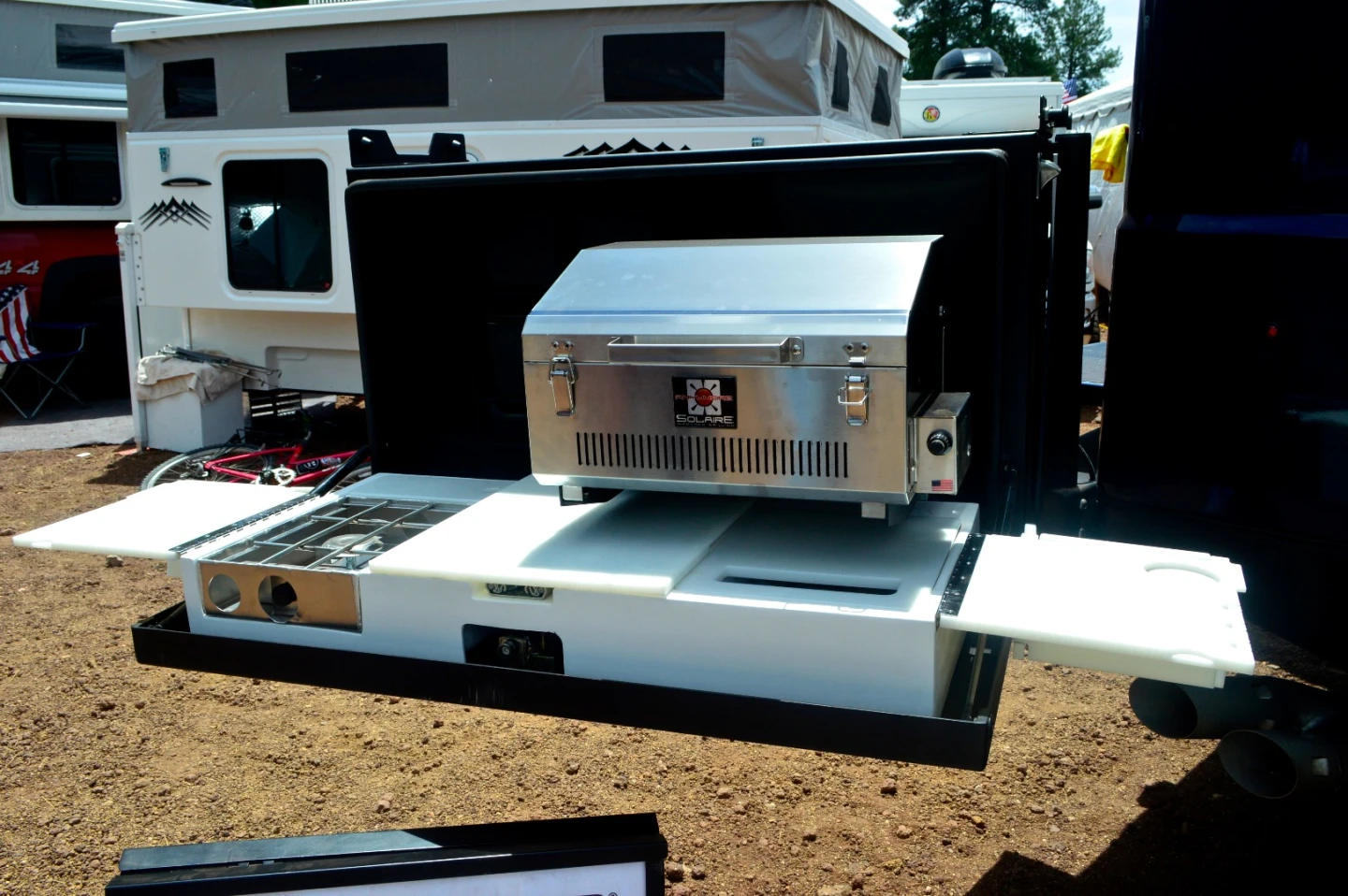 The available swing-out kitchen includes a grill, stove, sink and plenty of adjustable countertop space