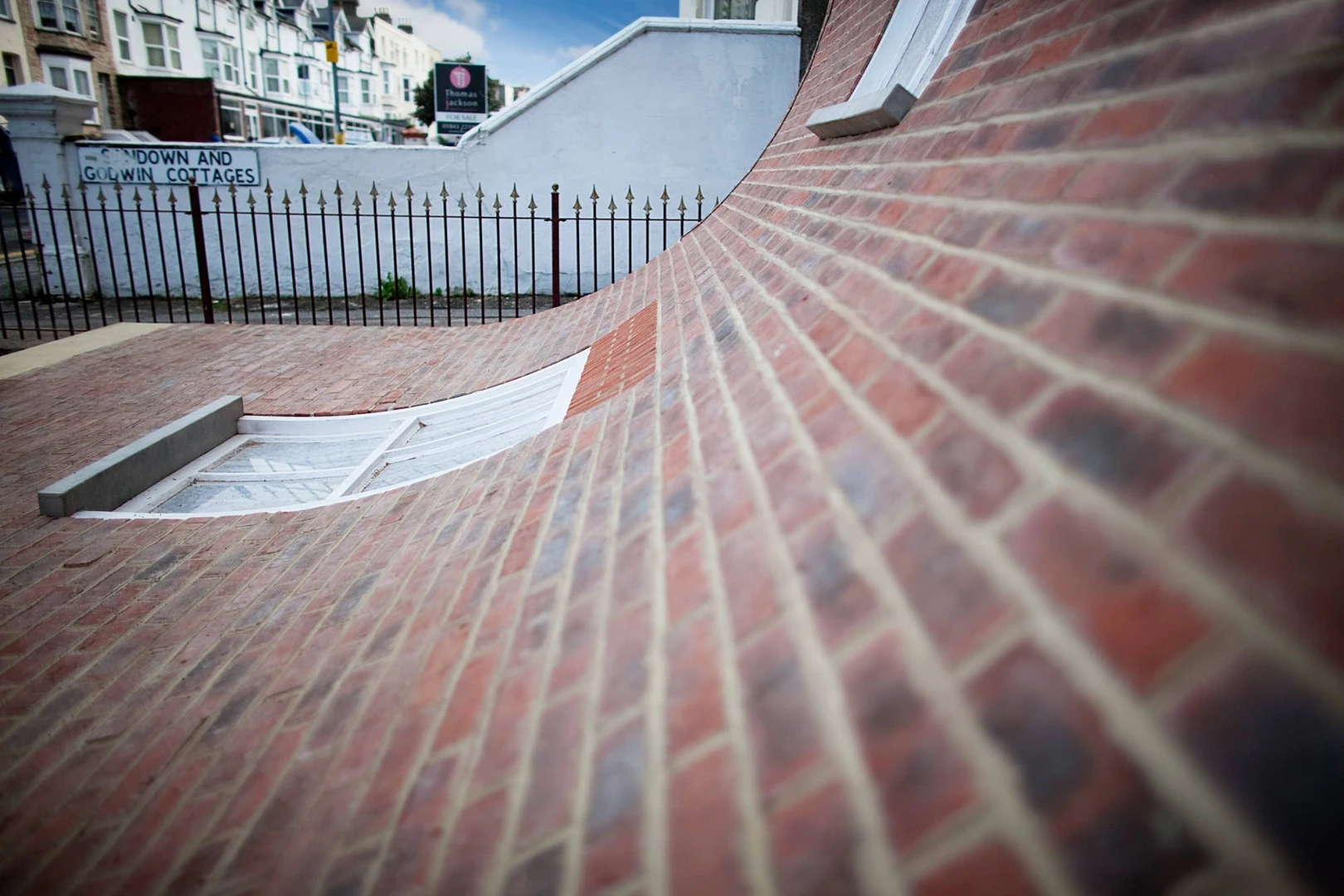 From the knees of my nose to the belly of my toes gave the impression a facade was slipping off the building, revealing a top floor usually hidden behind brickwork