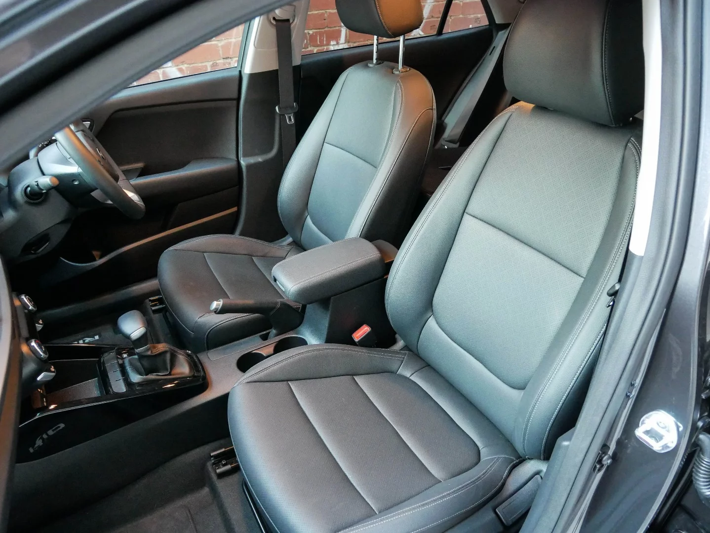 The pleather front seats in the Kia Rio