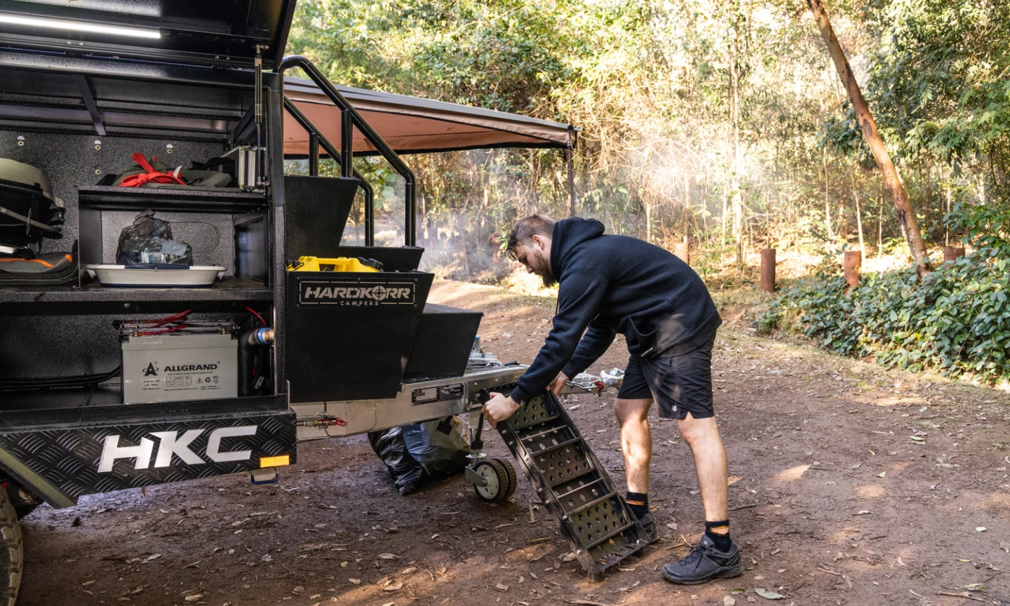 The removable folding staircase attaches to the front to complete the climb up to the tent